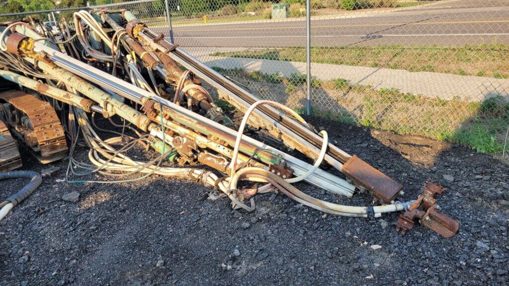 Gardner Denver air-track drill jumbo with twin boom assemblies and crawler undercarriage